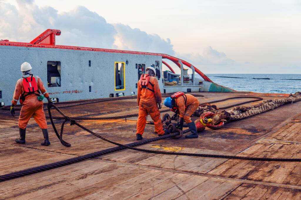 Vessel crew preparing vessel for static tow tanker lifting